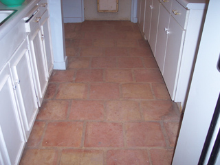 This kitchen floor is in desperate need of cleaning, luckily we have excellent cleaning services